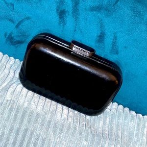 Every lady needs a Little black Clutch/ purse